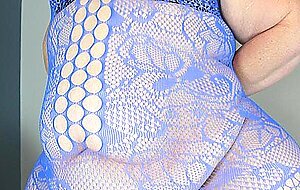 Redhead SSBBW Nikki Cakes models a bodystocking in her bedroom